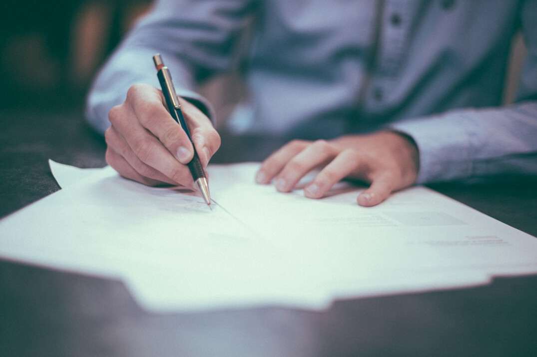 person writing notes