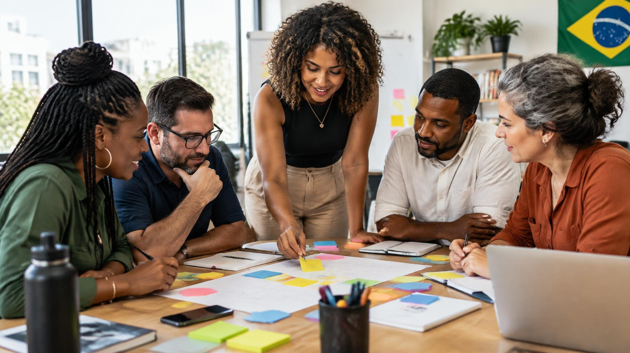 Team meeting around a table with notes